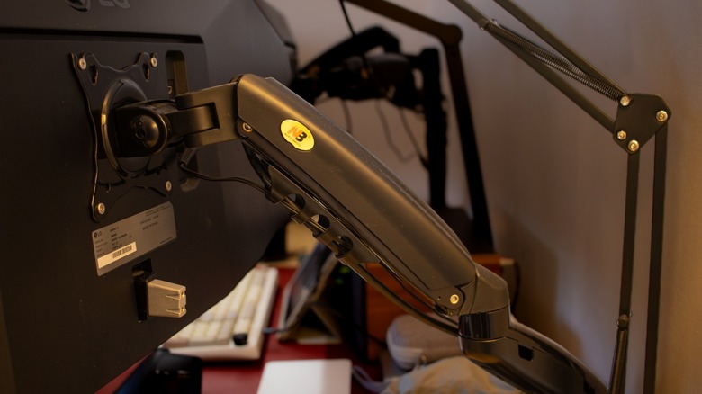 the author's monitors mounted on monitor arms