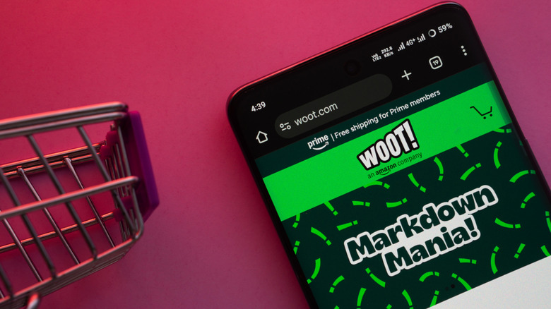 A smartphone showing the Woot website with a shopping card on the side