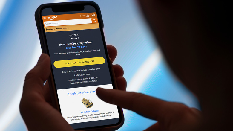 A man checking out Amazon Prime membership on a smartphone