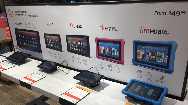 Various Kindle Fire tablets on display in a store in 2018.