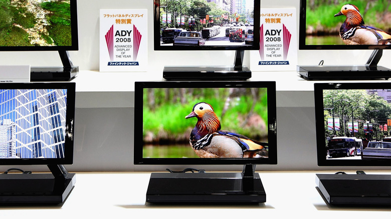 Displaays of Sony XEL-1 OLED tvs with an award showing in the background