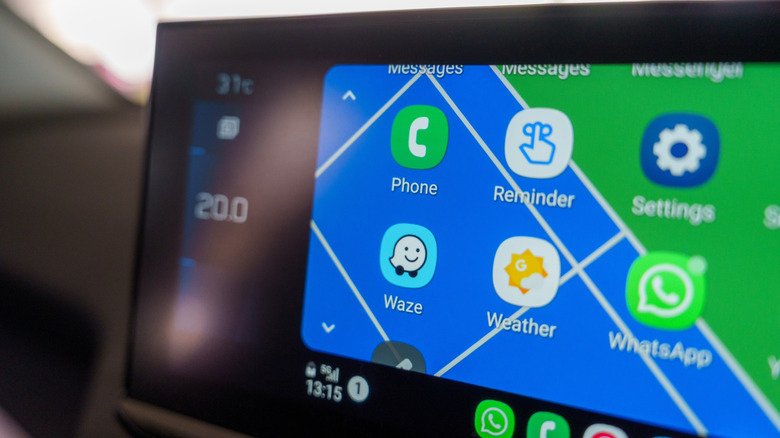 A close-up of a modern car's infotainment screen displaying Android Auto