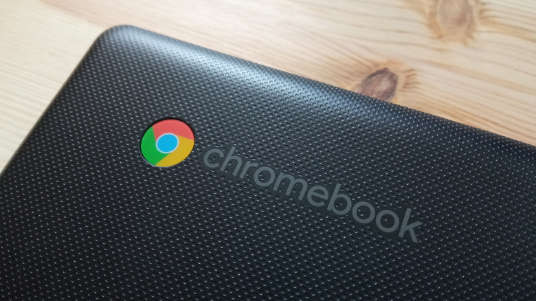 A closed Chromebook on top of a desk.