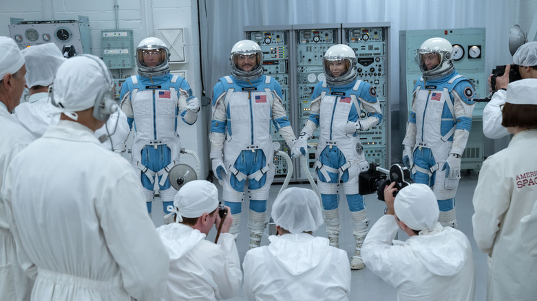 The Fantastic Four standing in their spacesuits