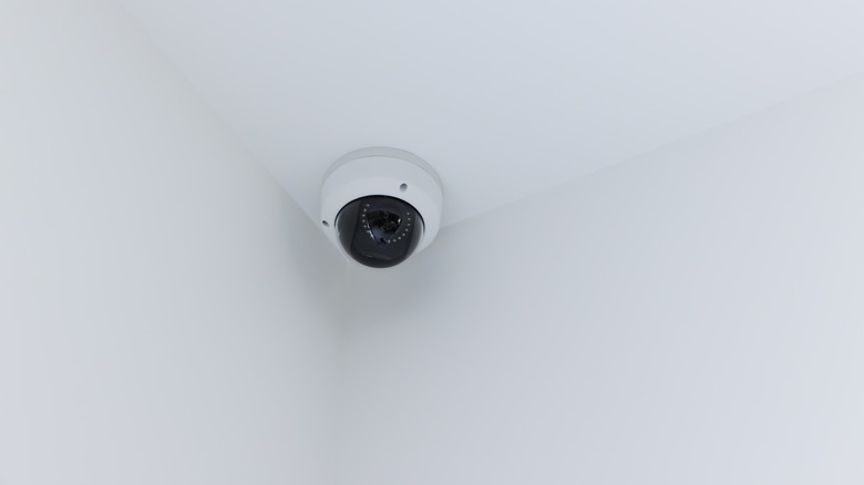Smart camera attached to white ceiling