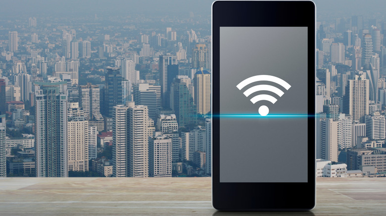 phone with a Wi-Fi icon and a cityscape backdrop