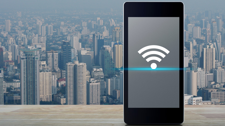 phone with a Wi-Fi icon and a cityscape backdrop