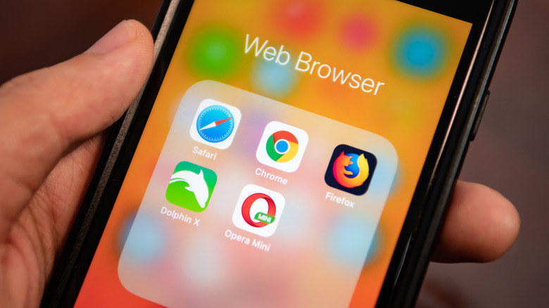 Close up of an iPhone showing a folder with web browsers.
