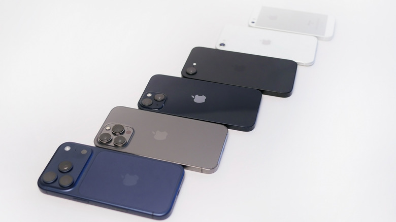 A line of iPhones from old to new models