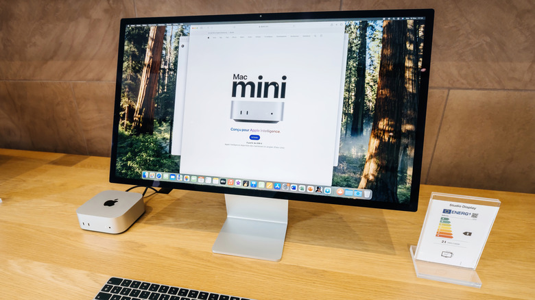 Mac mini on display next to a monitor