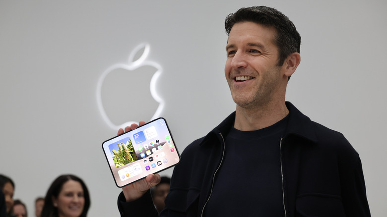 Apple CEO John Ternus holding the iPhone Duo