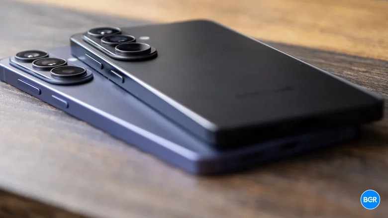 The Galaxy S26 and Galaxy S26 Plus on top of each other, on a table.