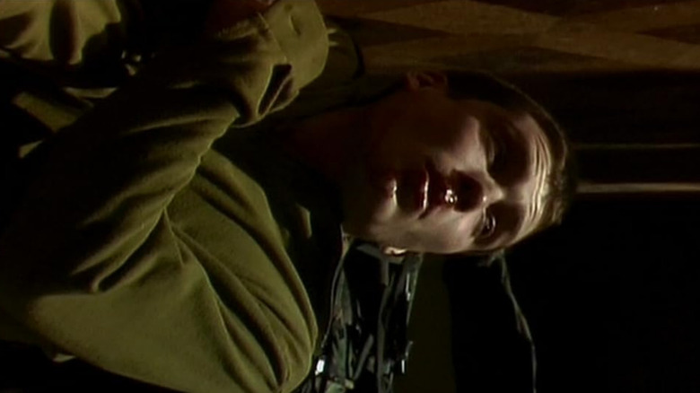 Cillian Murphy's character, Jim, lying down on the floor injured