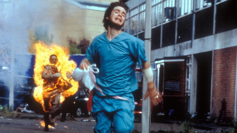 Cillian Murphy's character, Jim, running away from a zombie covered in flames