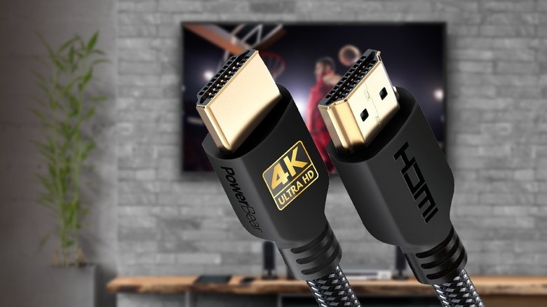 PowerBear 4K HDMI Cable showing heads superimposed over brick room with TV hanging
