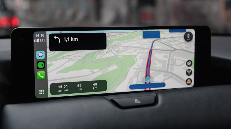 Android Auto on screen showing Waze app with map