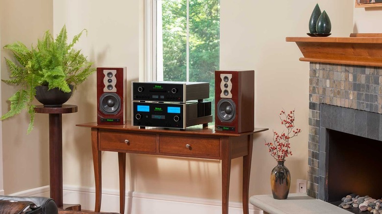 The McIntosh SoHo III stereo system set up on a table next to a fireplace
