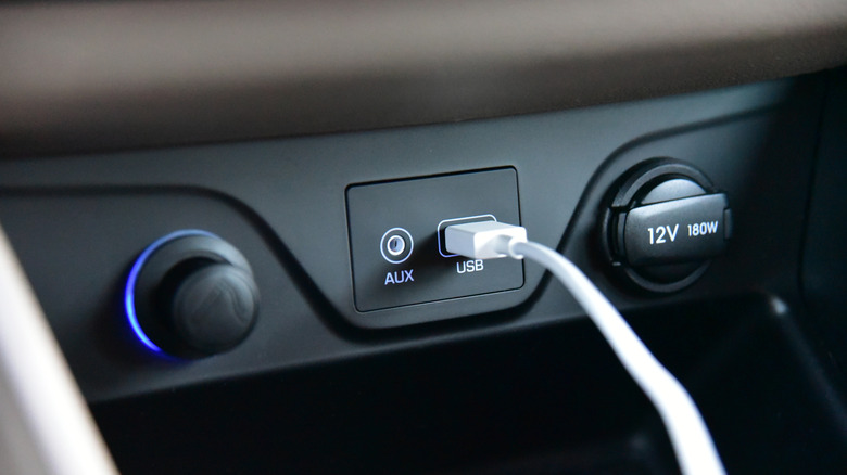 USB cable plugged into car dash port