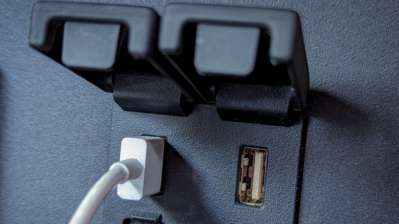 USB cable plugged into port of vehicle