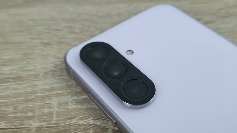 A close up of the triple lens camera system on a Samsung A56 5G smartphone