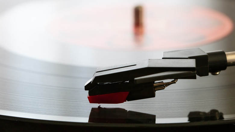 Close-up of a turntable cartridge on a record