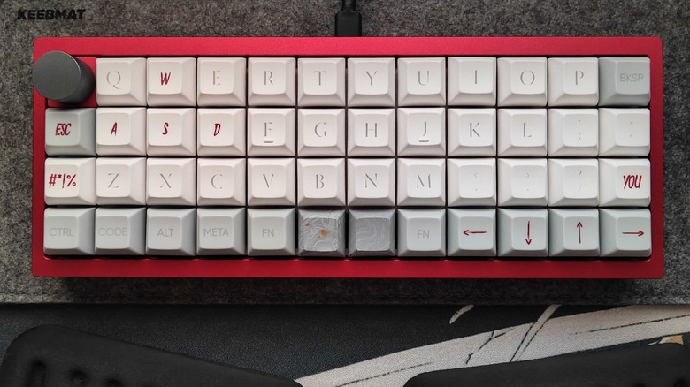 Ortho keyboard in red with hot swap knob in corner