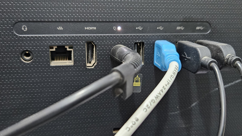 The back of a black monitor displaying several ports