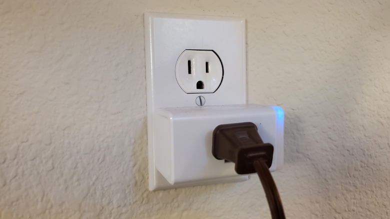 Close up of smart plug with cord plugged in