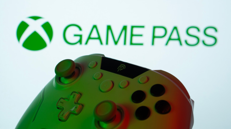 Controller in front of Game Pass logo