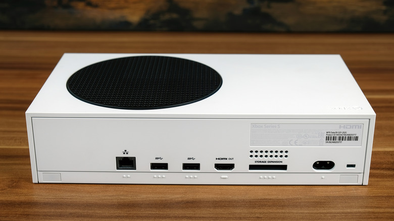 Xbox One S sitting on a wooden desk