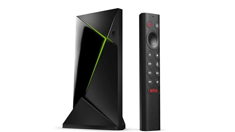 The Nvidia Shield TV Pro and its remote against a white background.
