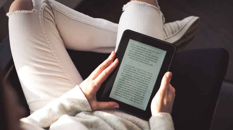 person reading book on a kindle
