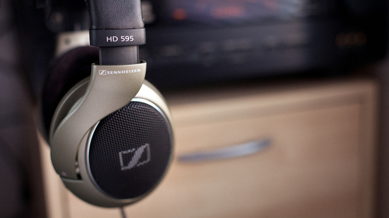 Sennheiser HD 595 over-ear headphones in front of a blurred background