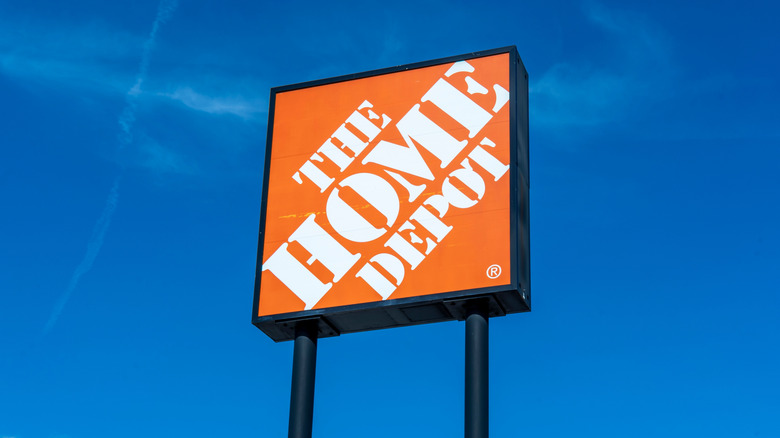 Home Depot sign against blue sky background