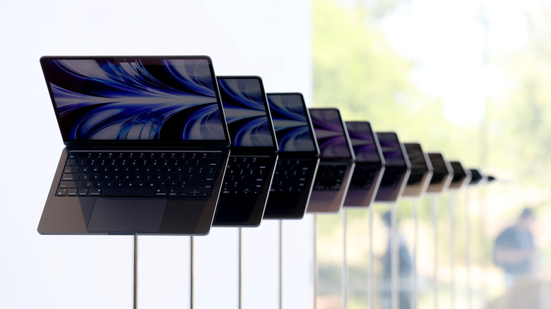A row of Apple M2 MacBook Airs being displayed after the WWDC 2022 keynote
