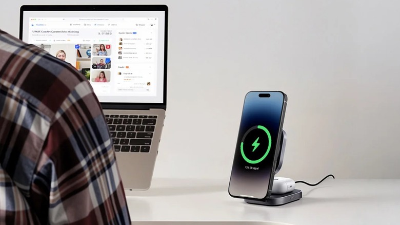 The Aukey MagFusion stand charging a phone and AirPods on a desk.