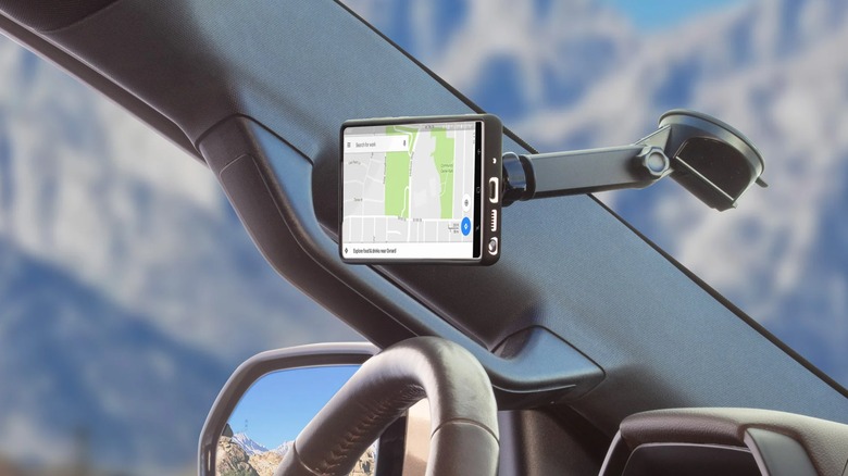 A Scosche MagicMount attached to a car windshield.