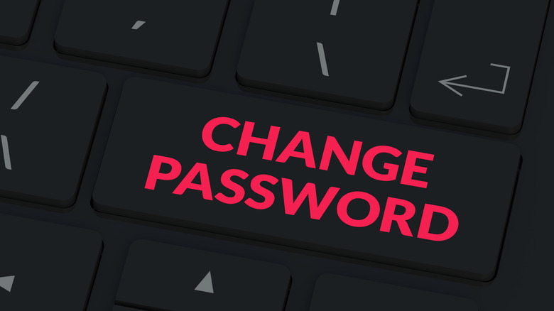 A close-up of a computer keyboard with a Change Password key in red letters