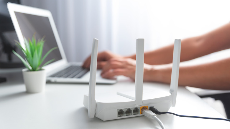 person connecting laptop to internet