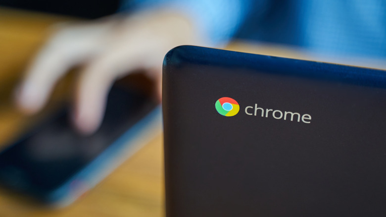 person using a Chromebook laptop