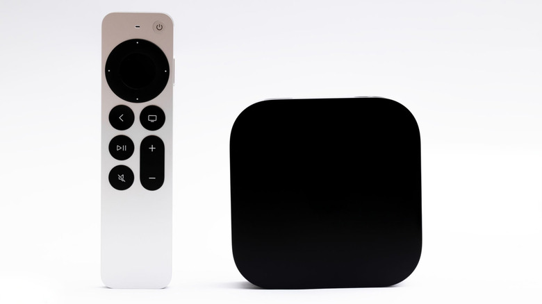 Apple TV 4K with Siri Remote against a grey background