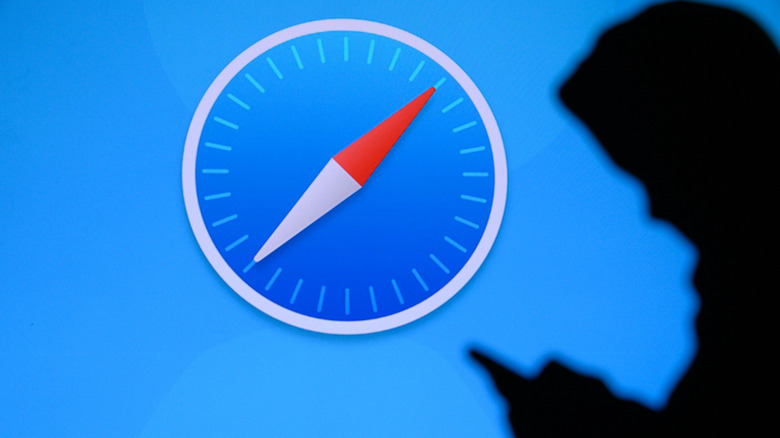Safari web browser icon on a screen with a person's silhouette in the foreground