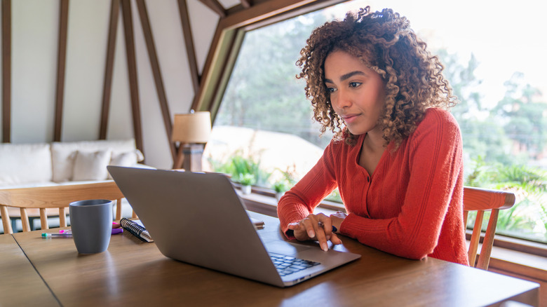 A woman using a laptop