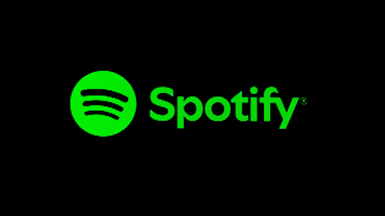 Green Spotify logo on screen with black background