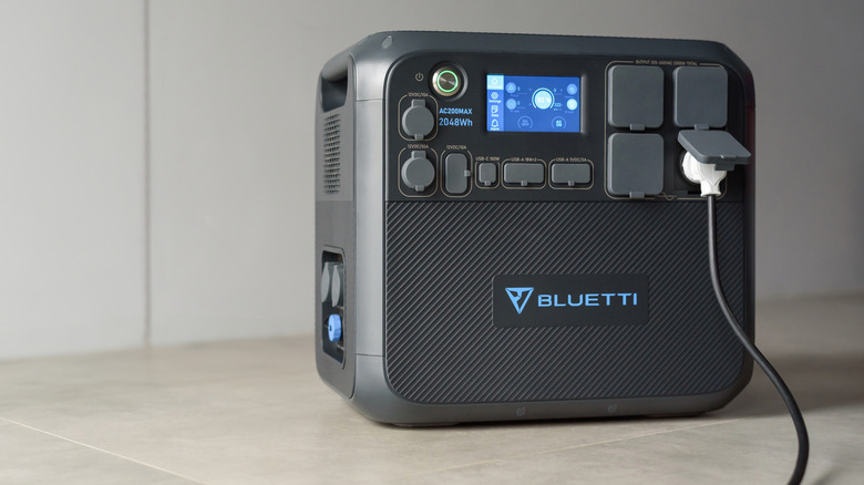 A Bluetti portable power station on a stone surface
