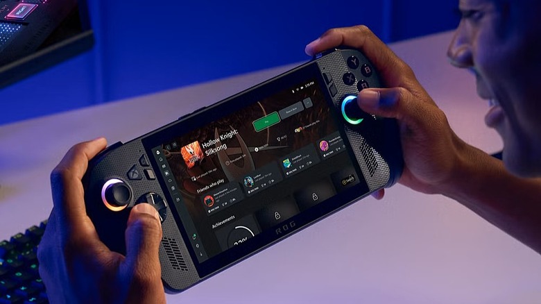 Rog Xbox Ally X held in hand with store on screen