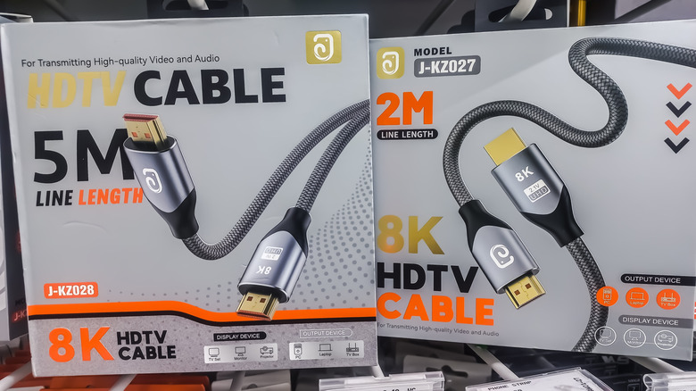 Two boxes of 8K HDMI cables in a store