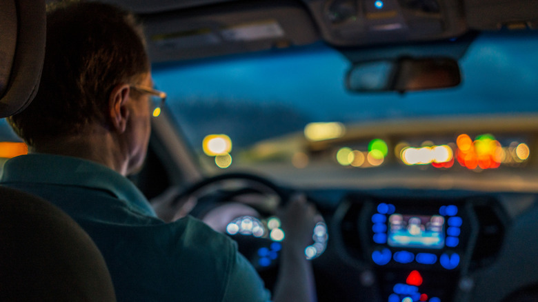 A person driving on a busy highway