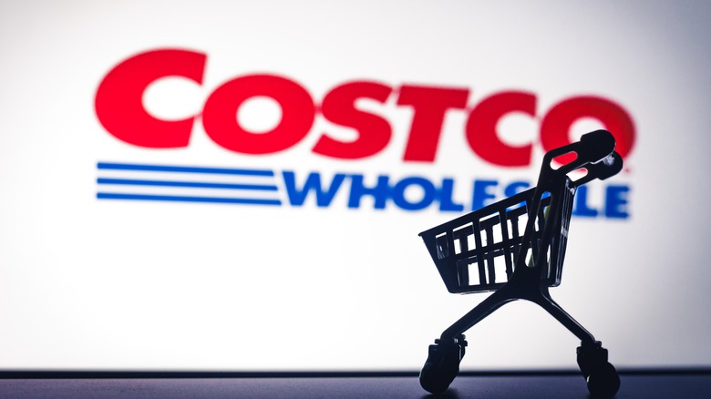 Costco Wholesale logo in the background of a shopping cart