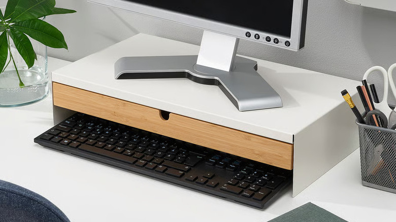Elloven Monitor stand with drawer placed on a desk